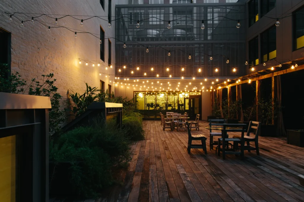 a patio with a lot of tables and chairs