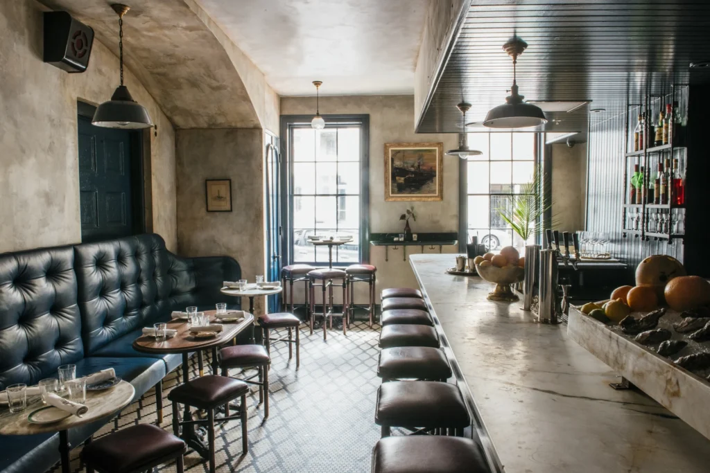 a restaurant with a long bar and lots of seating