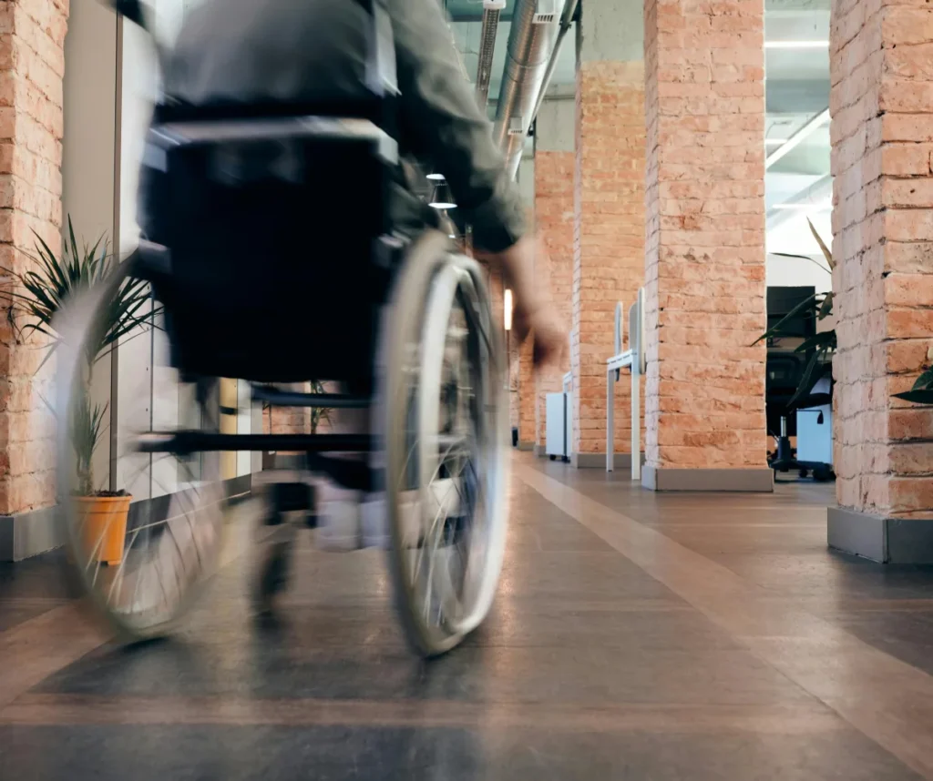 a man in a wheel chair in a building